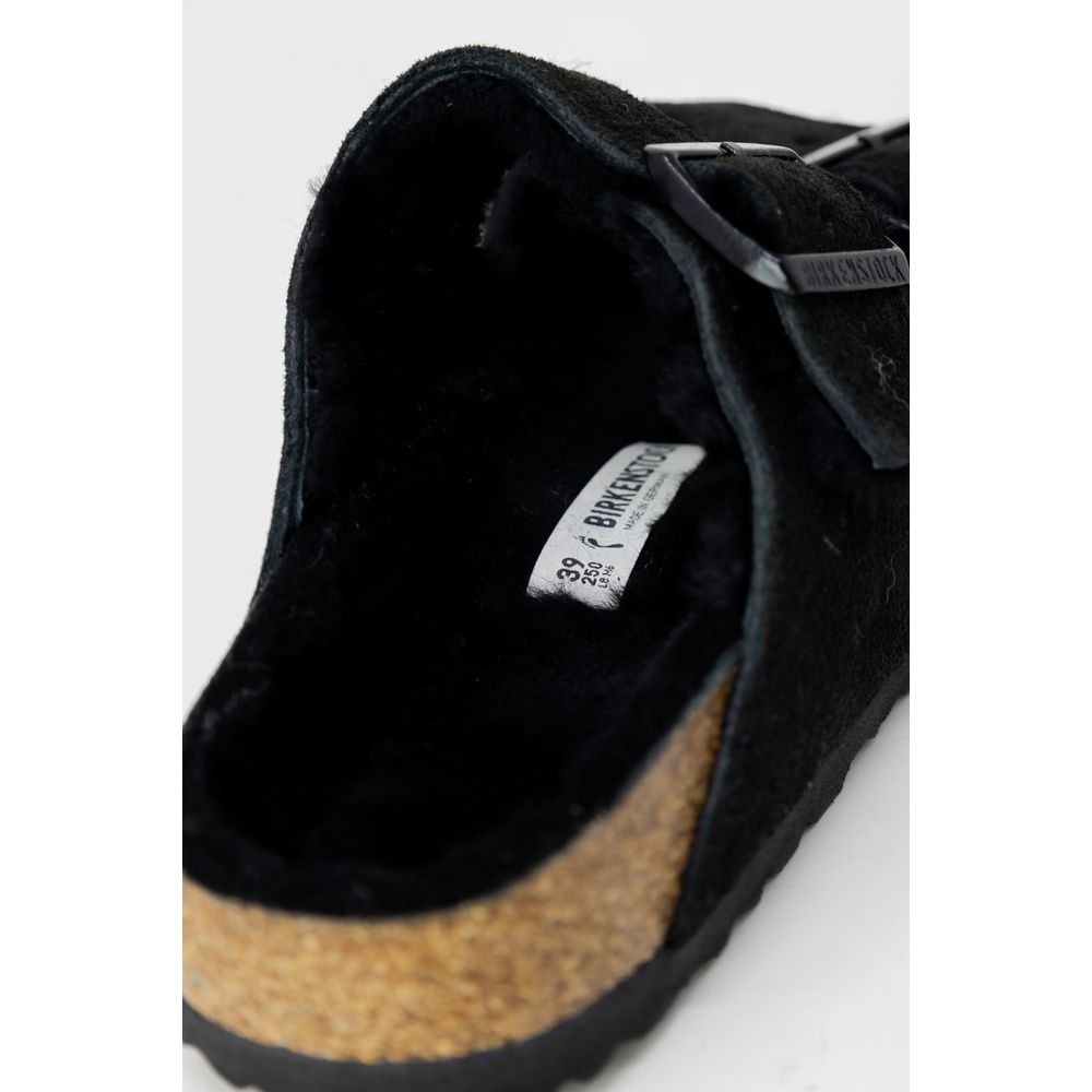 Close-up of Birkenstock Black Suede Leather Slippers with adjustable metal buckle and shearling lining