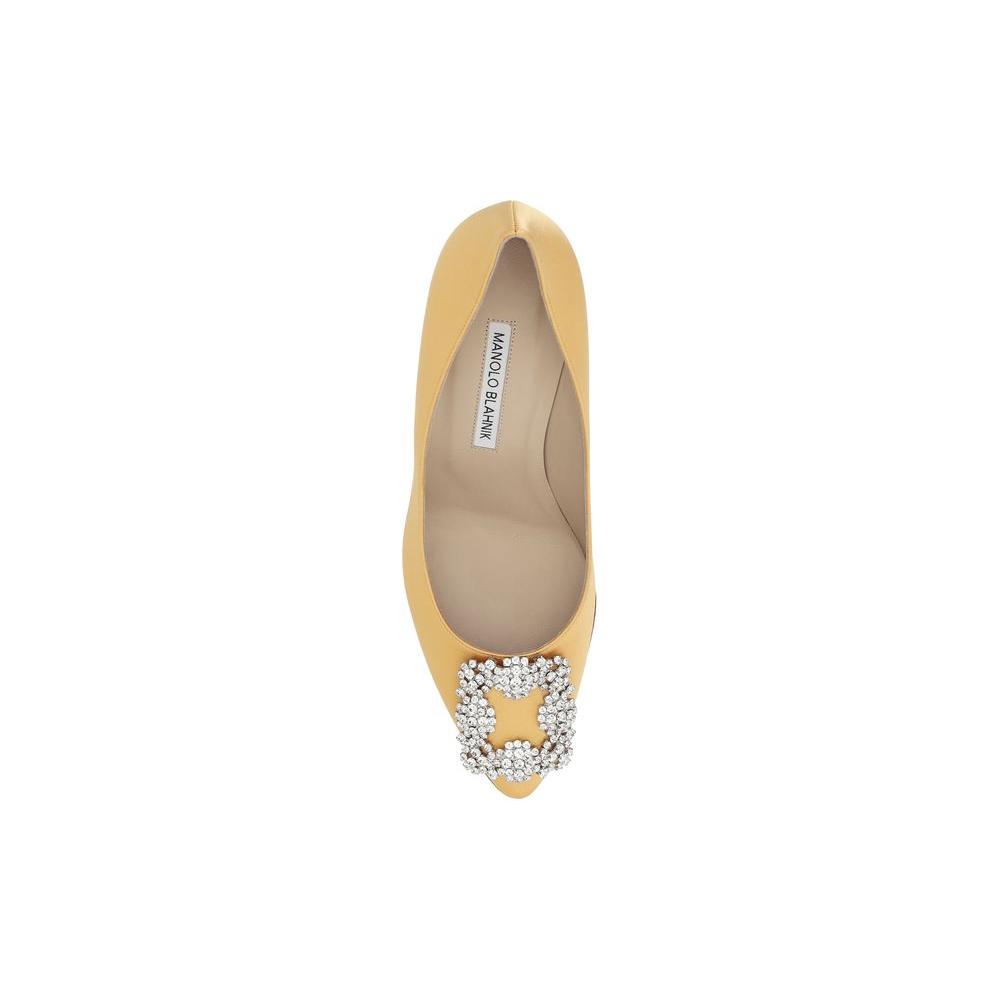 Manolo Blahnik Hangisi PumpsSilk Satin Hangisi Pumps by Manolo Blahnik, almond toe, iconic Swarovski crystal buckle appliqué on front, leather stiletto heel, logo-embossed insole.