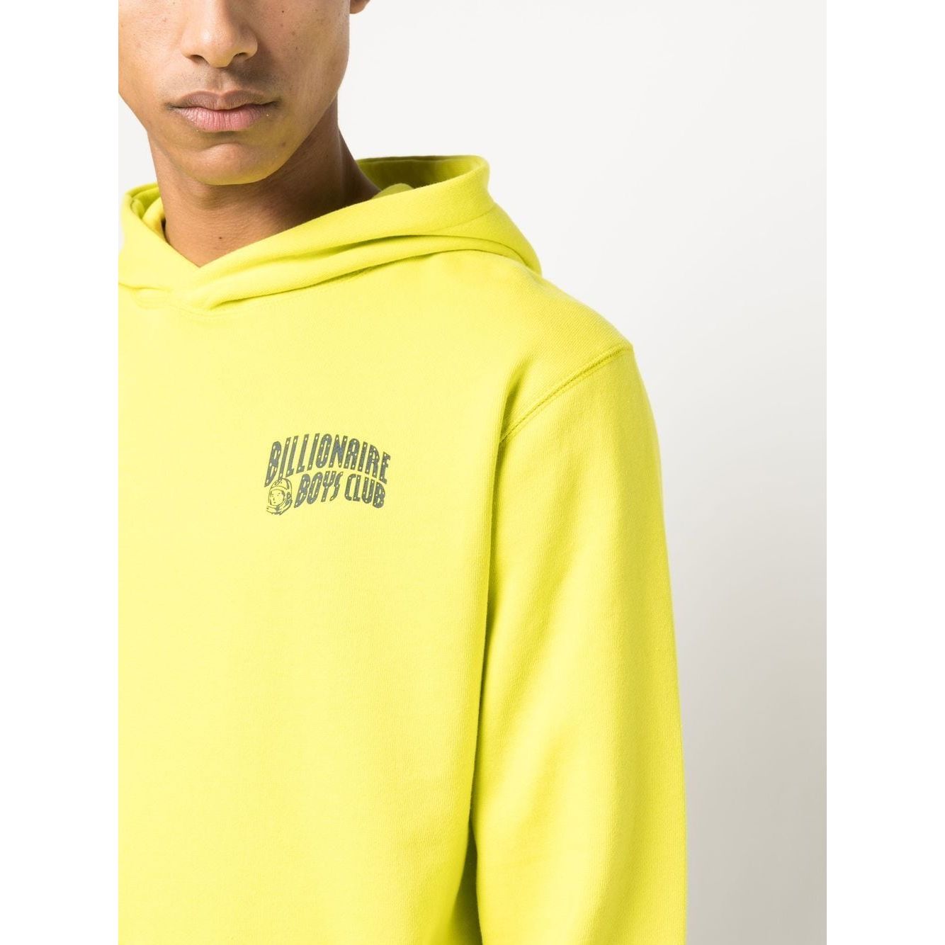 Yellow hoodie with logo print on chest and embroidered logo on sleeve, featuring a hood and kangaroo pocket, from Billionaire Sweaters.
