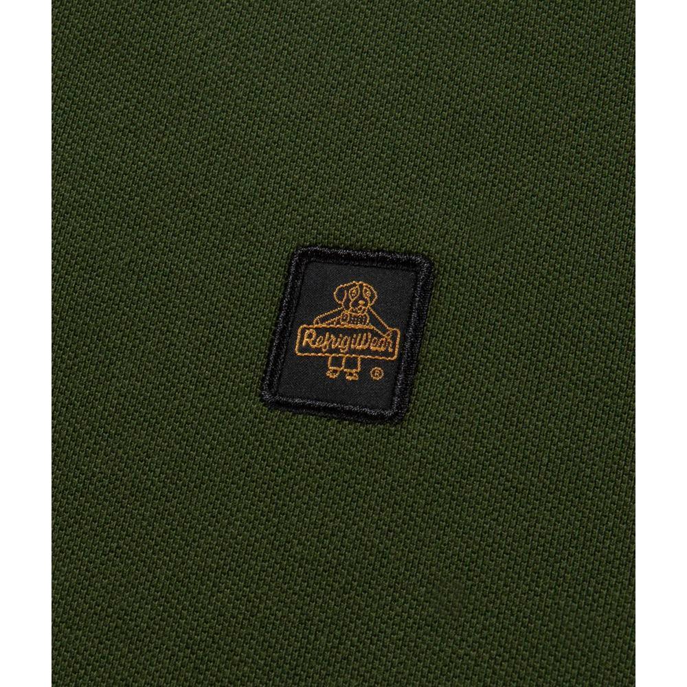 Close-up of the logo on a Refrigiwear green cotton polo shirt, showcasing solid-colored pique fabric and detailed stitching.