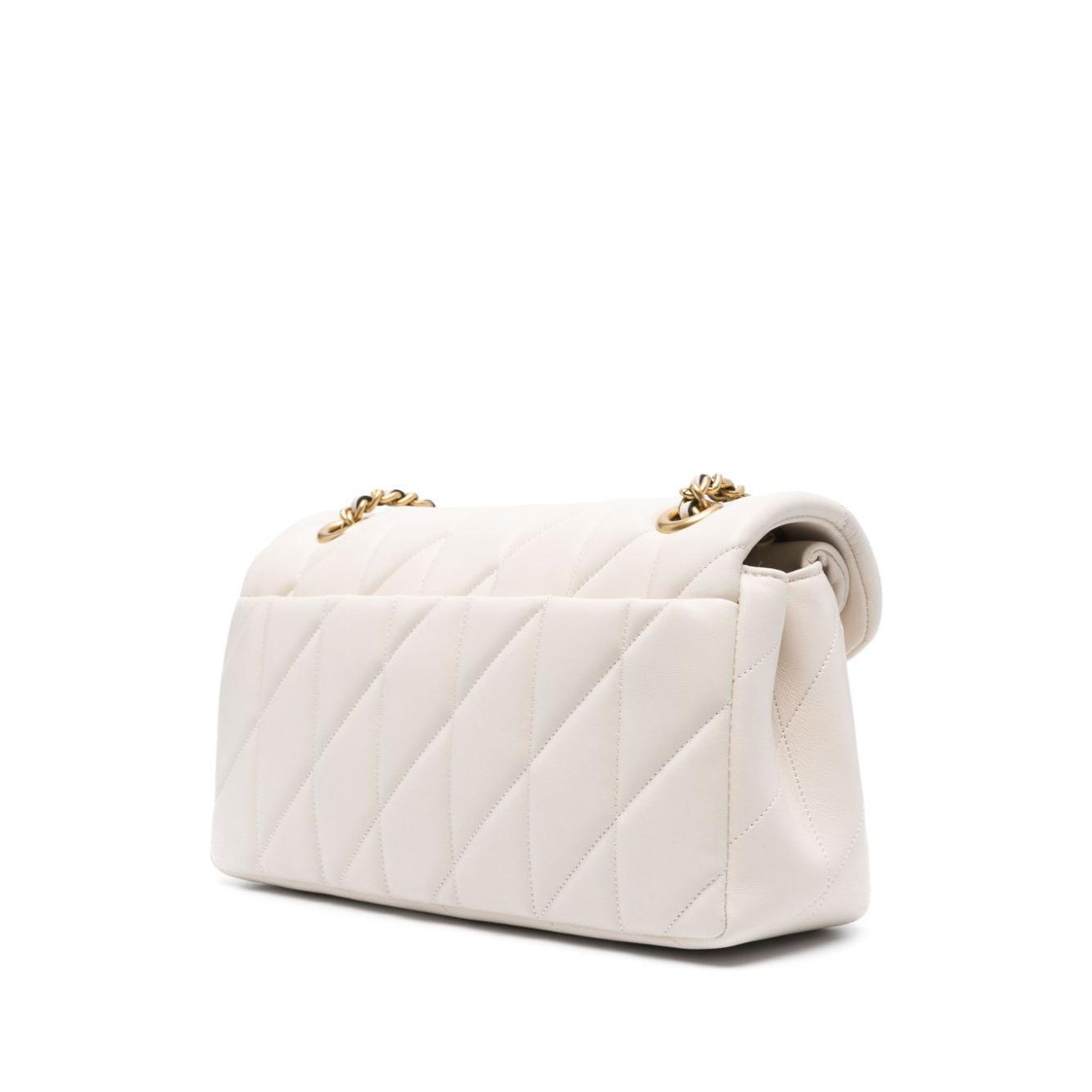 Front view with bag zipped and handles upright.