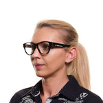 Woman wearing Tod's Black Women Glasses Frame with round, full-rim design, plastic material, and a sophisticated look.