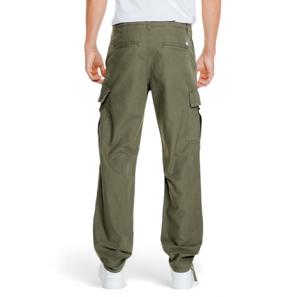 Man wearing Jack Jones Green Cotton Cargo Pants with spacious side flap pockets, showcasing a modern tapered fit.