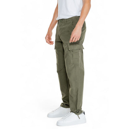 Man wearing Jack Jones Green Cotton Cargo Pants with flap pockets and tapered fit.