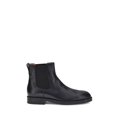 Tod's Black Calf Leather Bos Taurus Chelsea Boots with elastic side inserts and back tab for easy fit, offering minimalist style for AW25.
