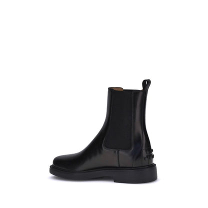 Tod's Black Calf Leather Bos Taurus Chelsea Boots with elastic sides and rubber sole, featuring comfort and grip design.