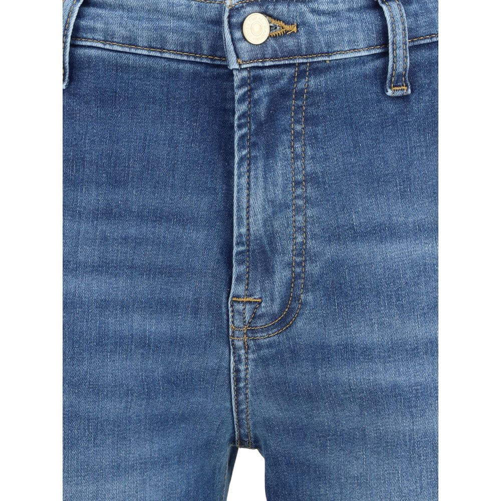 Close-up of 7FOR Blue Cotton Flared Jeans showcasing front zipper, button closure, and waist loops for a modern silhouette.