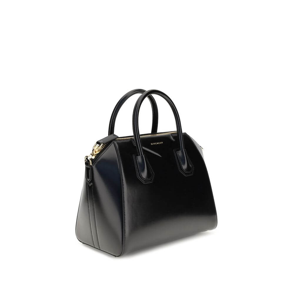 Givenchy Black Calf Leather Bos Taurus Handbag with gold-finished hardware and adjustable strap.