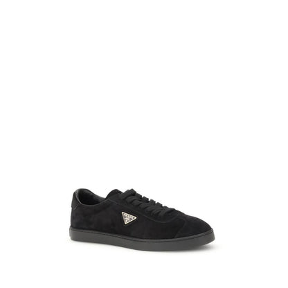 Prada Black Calf Leather Bos Taurus Low Top Sneakers with triangular plaque and logo on rubber sole.