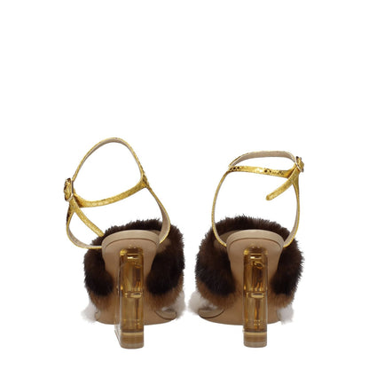 Fendi Brown Mink Strap-On Sandals with gold buckle closure and high heels, featuring a vintage effect and open toe design.