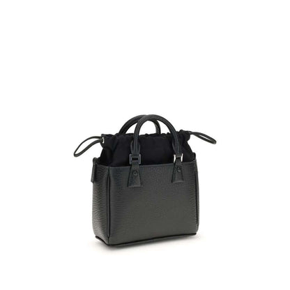Margiela Black Calf Leather Bos Taurus Shoulder Bag with metal rivets and hand-painted edges, AW25 collection, 16x16x6 cm.