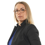 Woman wearing Ted Baker Brown Women Glasses Frame with acetate full-rim and cat eye style, posing confidently against a white background.