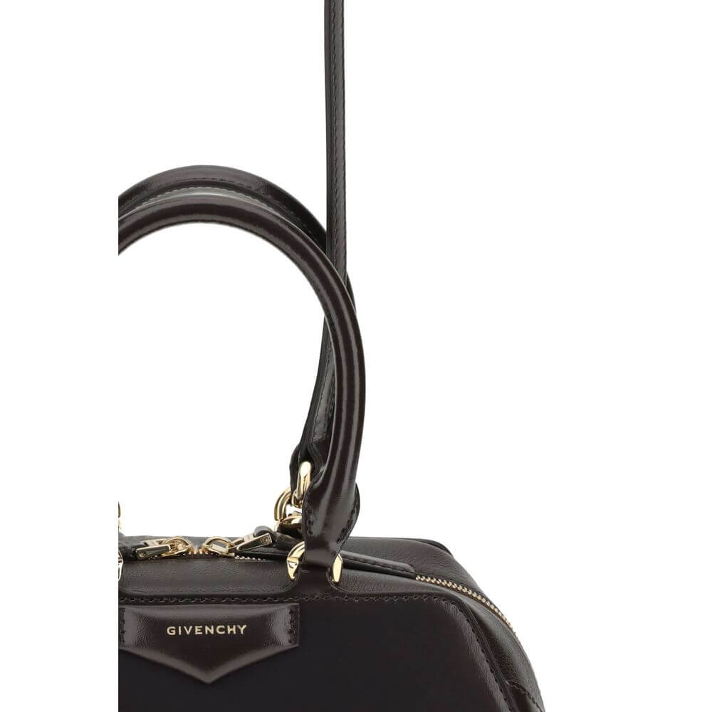 Close-up of Givenchy Brown Calf Leather Bos Taurus Handbag with leather handles and gold-finish hardware detail.
