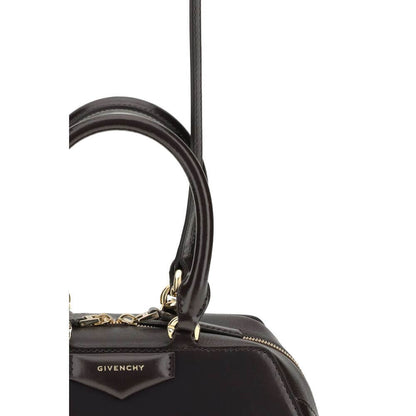 Close-up of Givenchy Brown Calf Leather Bos Taurus Handbag with leather handles and gold-finish hardware detail.