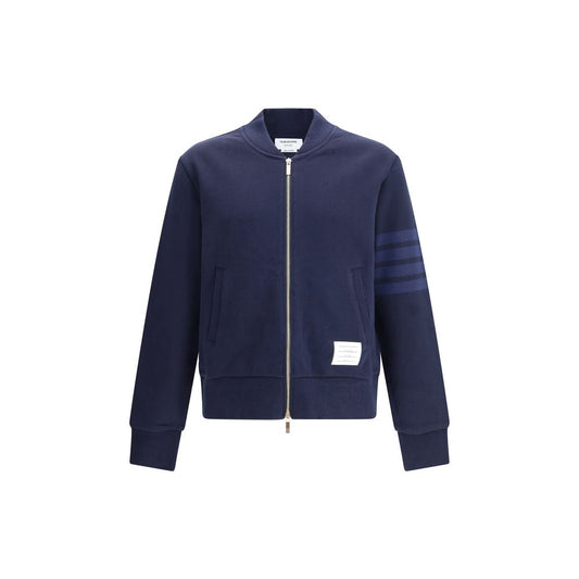 Thom Browne Zip Sweatshirt with front zipper, ribbed cuffs, and iconic stripes on sleeve; 100% cotton, made in Japan.