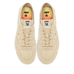 Top view of AUTRY Sneakers Ivory with canvas upper, lace-up design, and beige jute sole, featuring logo patch and tonal stitching.