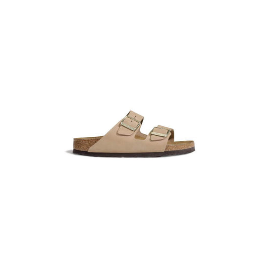 Birkenstock Beige Nubuc Leather Sandal with adjustable straps and cork footbed for comfort and style.