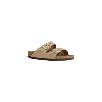 Birkenstock Beige Nubuc Leather Sandal with adjustable metal buckles and cork footbed, side view.