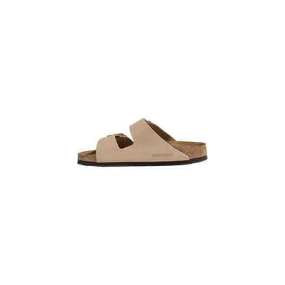 Birkenstock Beige Nubuc Leather Sandal with adjustable straps and cork footbed, side view.