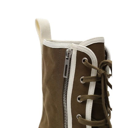 Close-up of Bottega Veneta Green Cotton Lace-Up Boots showing side zip and white trim.