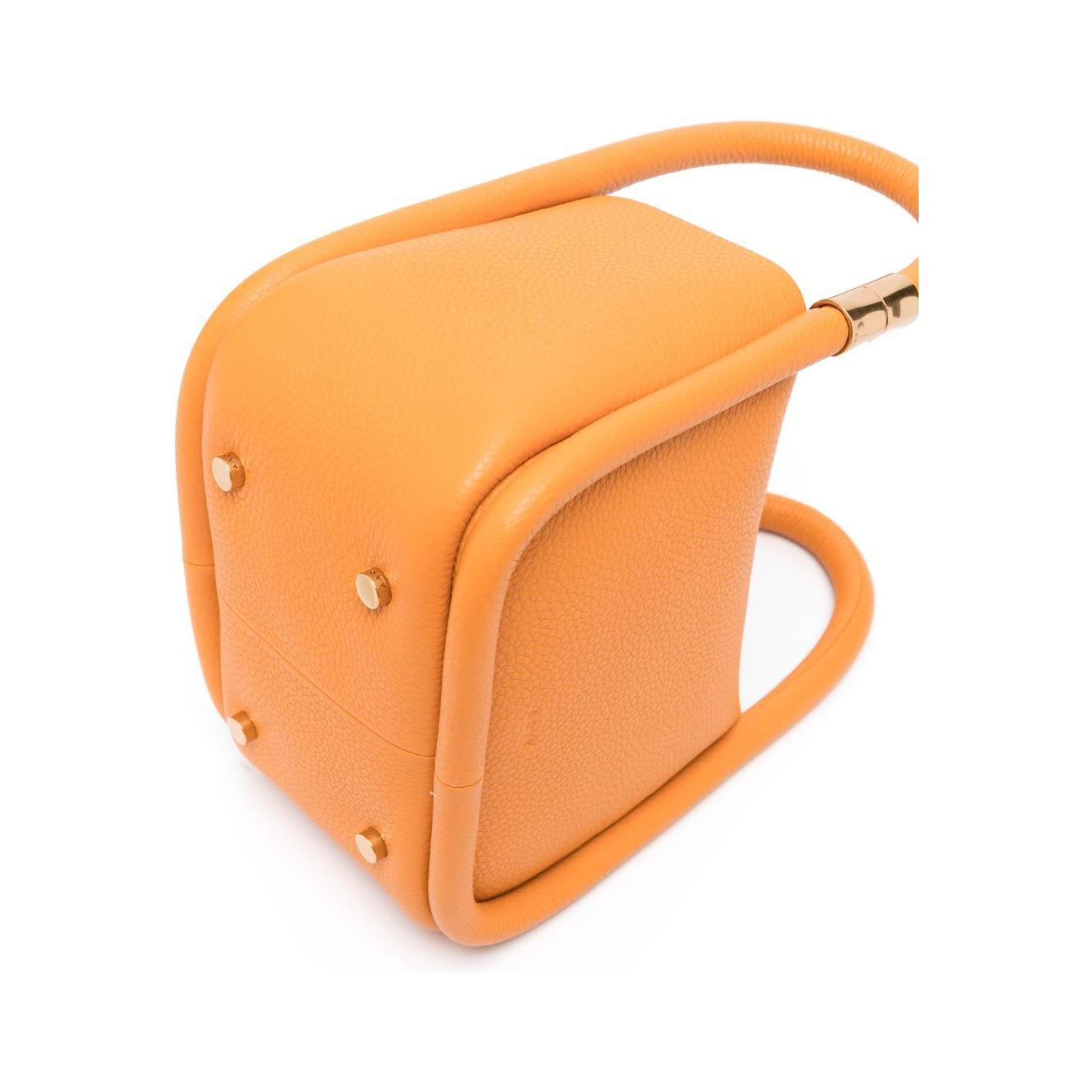 Front view with bag zipped and handles upright.