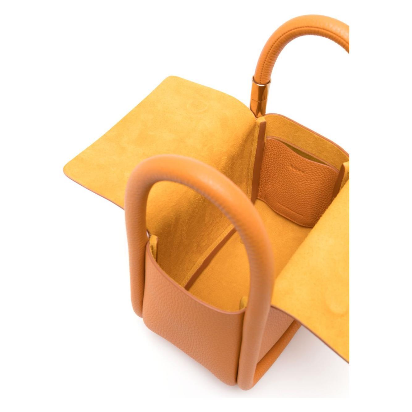 Front view with bag zipped and handles upright.