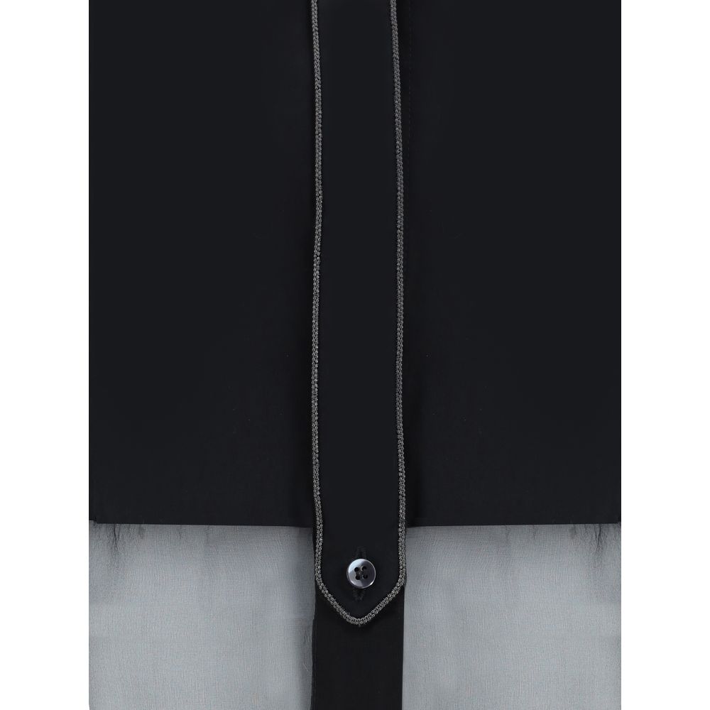 Close-up of Brunello Cucinelli Black Cotton Pattern Shirt showcasing semi-transparent design and button detail.