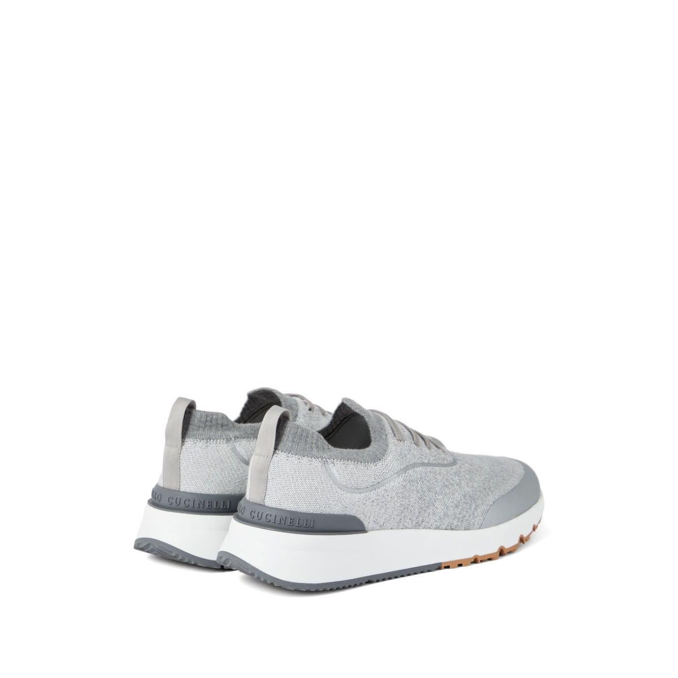 Brunello Cucinelli Techno cotton knit runners featuring light grey knit upper, flat sole, and rubber heel insert with textured sole.