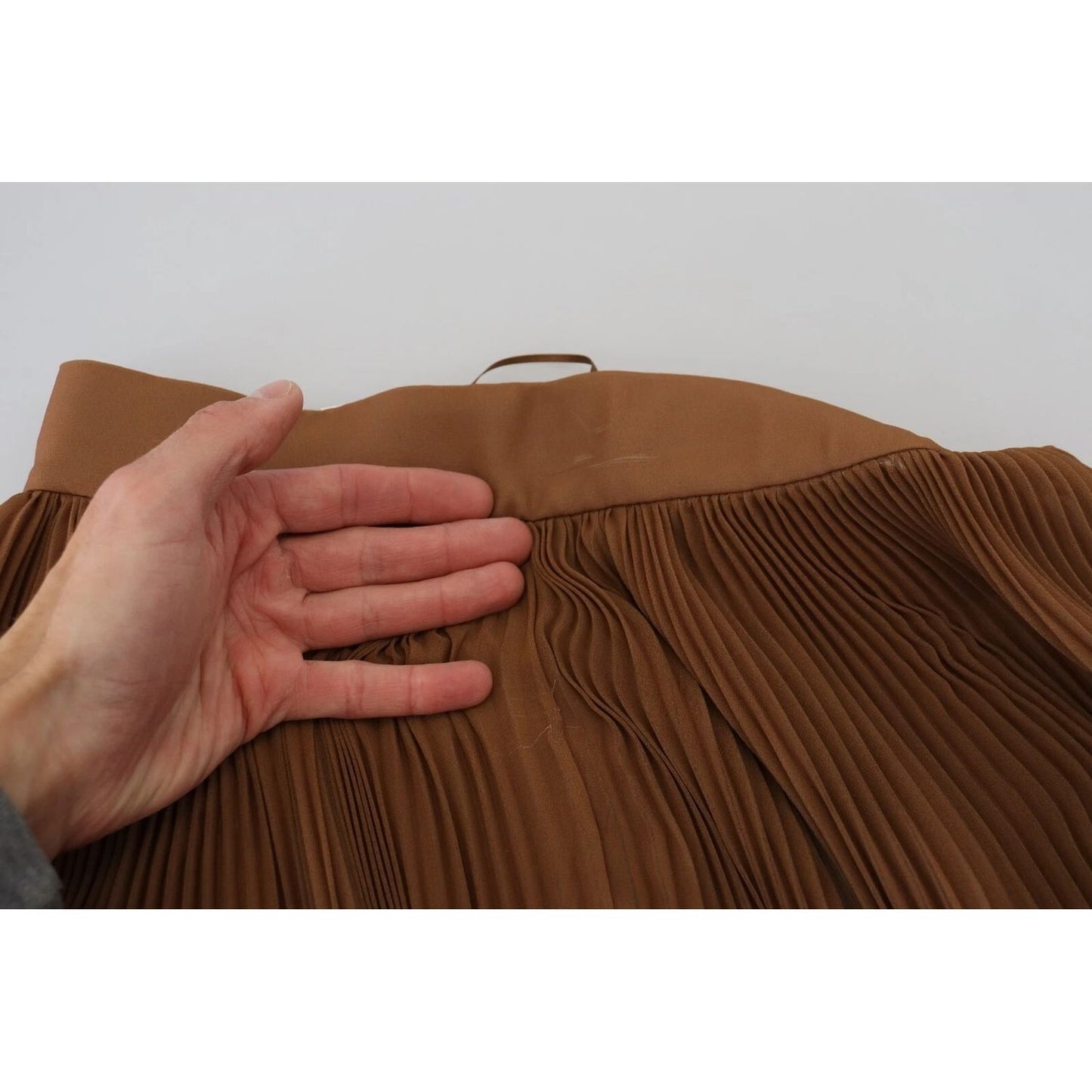 Dolce & Gabbana Beige Longuette Plisse Chiffon Midi Skirt showing pleated details and high waist design.