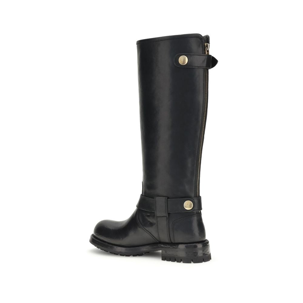 Side view of Dolce & Gabbana Black Calf Leather Bos Taurus Lace-Up Boots with buckle detailing and rugged sole.
