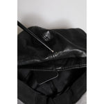 Dolce & Gabbana Black Calf Newsboy Capello Cabbie Hat close-up showing minor defect on leather material