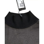 Dolce & Gabbana Black Mesh Turtleneck Sheer Blouse Top with tag, showcasing polyester material and logo details, includes minor defects.