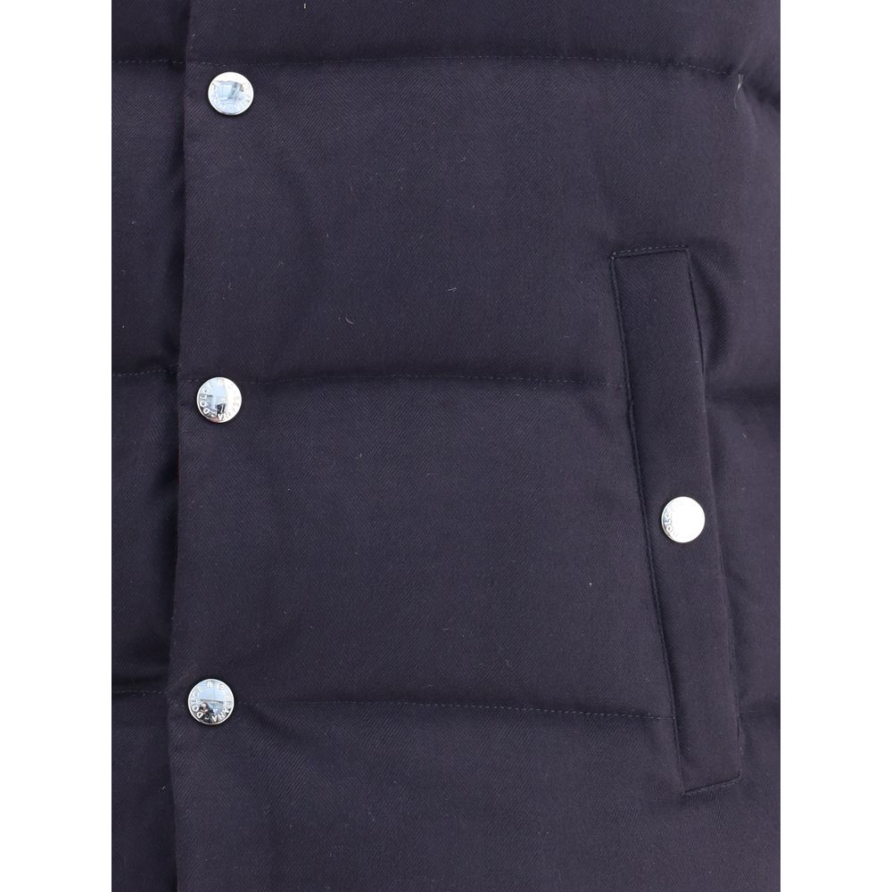 Close-up of Dolce & Gabbana Blue Cotton Jackets And Coat showing snap button closure and buttoned welt pocket detail.