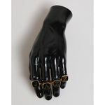 Dolce & Gabbana Gold Tone Brass JAZZ Letter Set 4 Pieces Adjustable Ring displayed on black mannequin hand