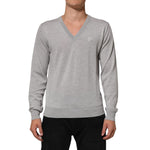 Dolce & Gabbana Gray Wool Knit Logo V-Neck Pullover Sweater on a model with classic design and luxurious fabric.