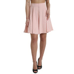 Woman modeling Dolce & Gabbana Light Powder Rose Viscose Pleated Skirt with high waist and flared silhouette, elegant and feminine style