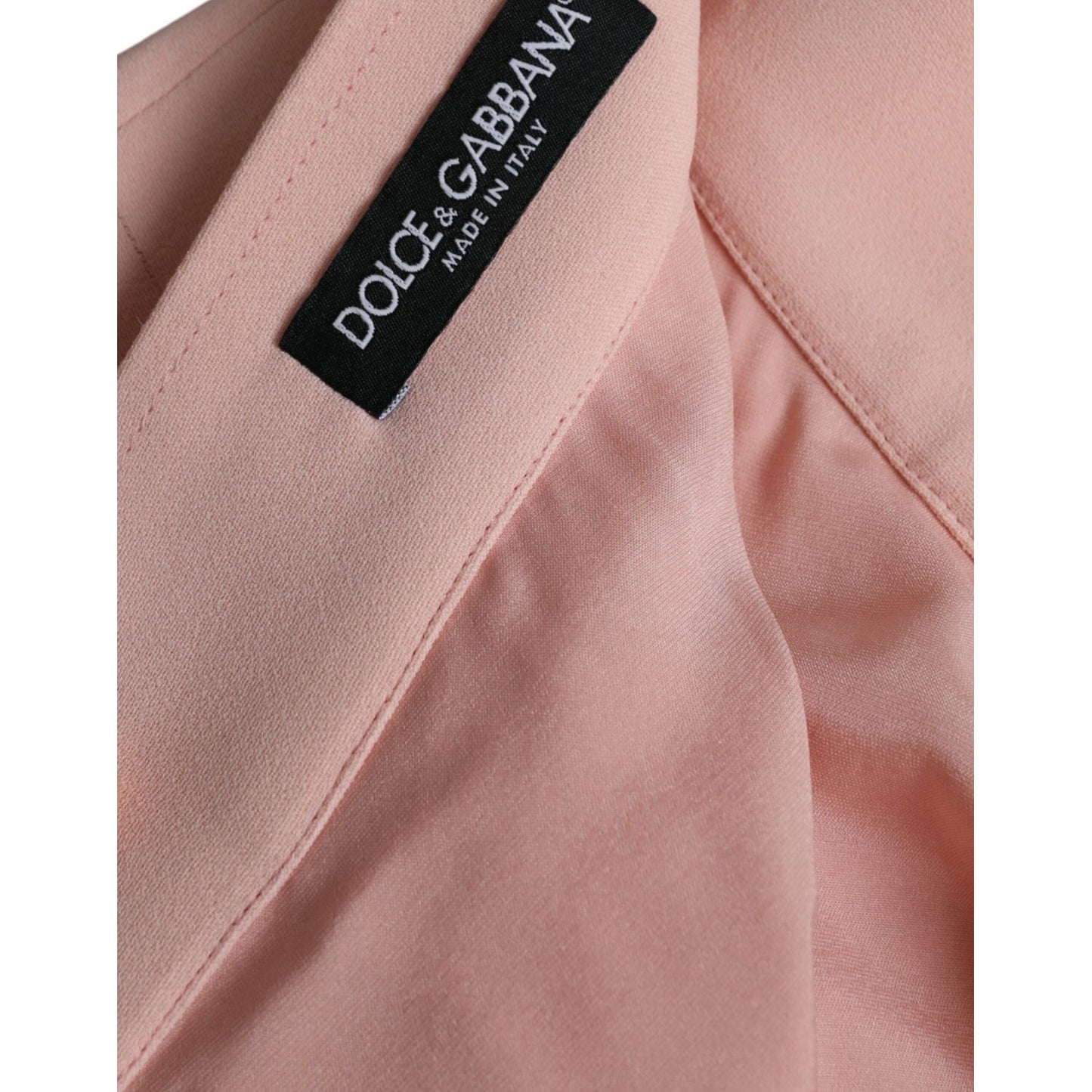 Close-up of Dolce & Gabbana Light Powder Rose Viscose Pleated Skirt fabric and label