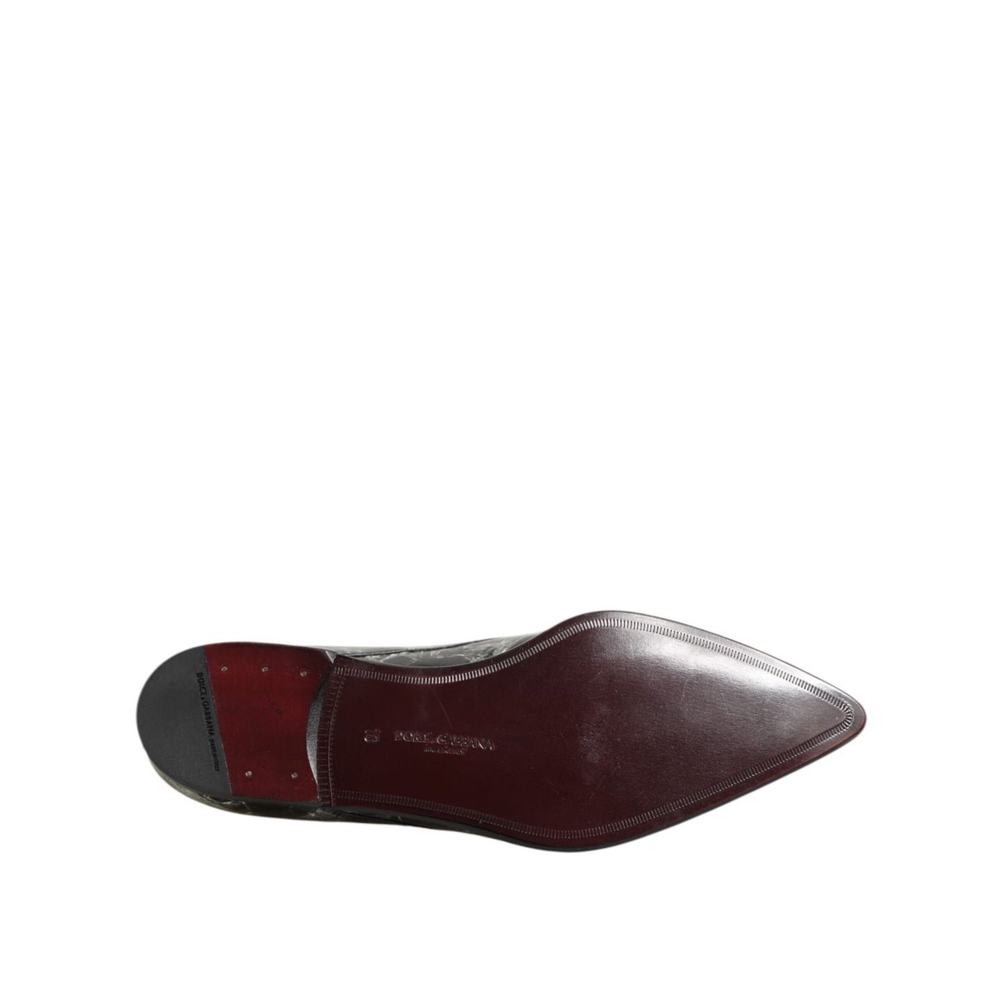 Sole view of Dolce & Gabbana Marbled Pattern Dress Lace Up Derby Shoes in black leather with detailed craftsmanship.