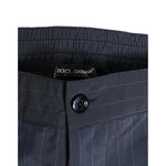Close-up of Dolce & Gabbana Navy Blue Polyester Pinstripe Men Shorts Swimwear waistband with button detail.