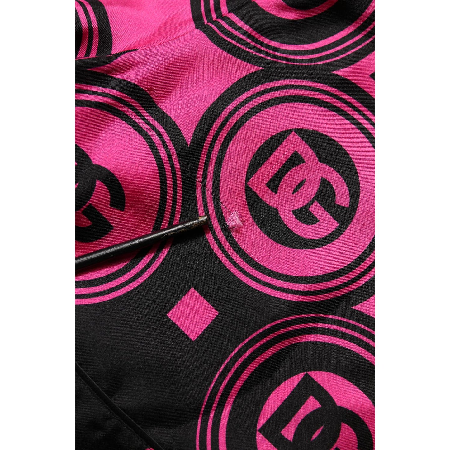 Dolce & Gabbana Pink Black Silk Logo Print DG Pattern Shorts close-up showing logo details on luxurious fabric.
