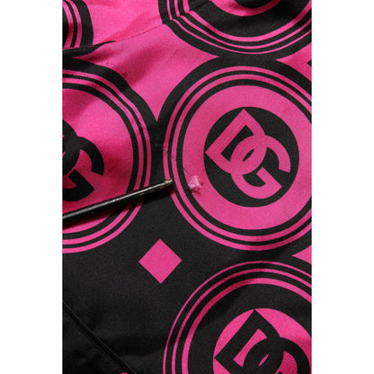 Dolce & Gabbana Pink Black Silk Logo Print DG Pattern Shorts close-up showing logo details on luxurious fabric.