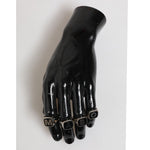 Black hand display featuring Dolce & Gabbana Silver Tone Brass Lettering Set 5 Pieces Adjustable Ring with 'M A B O' letters.