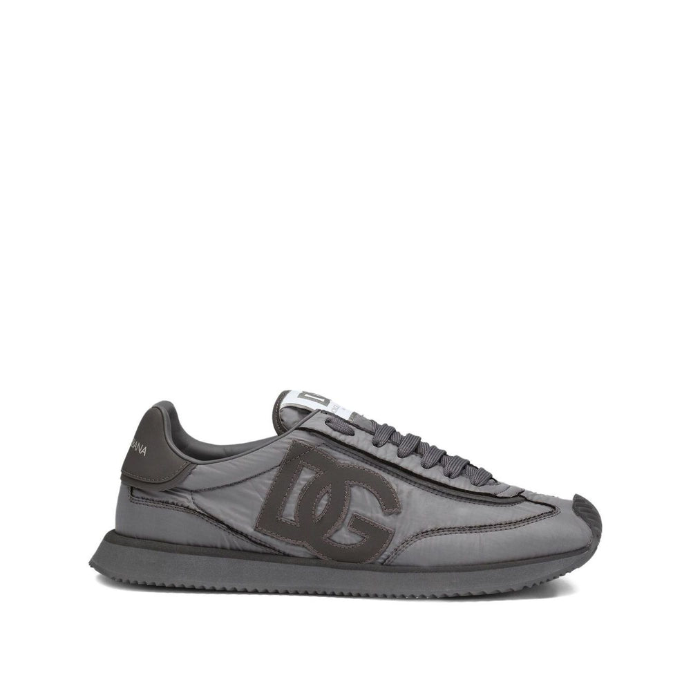 Dolce & Gabbana Sneakers Grey with embroidered logo, lace-up, flat rubber sole, and padded collar in dark gray.