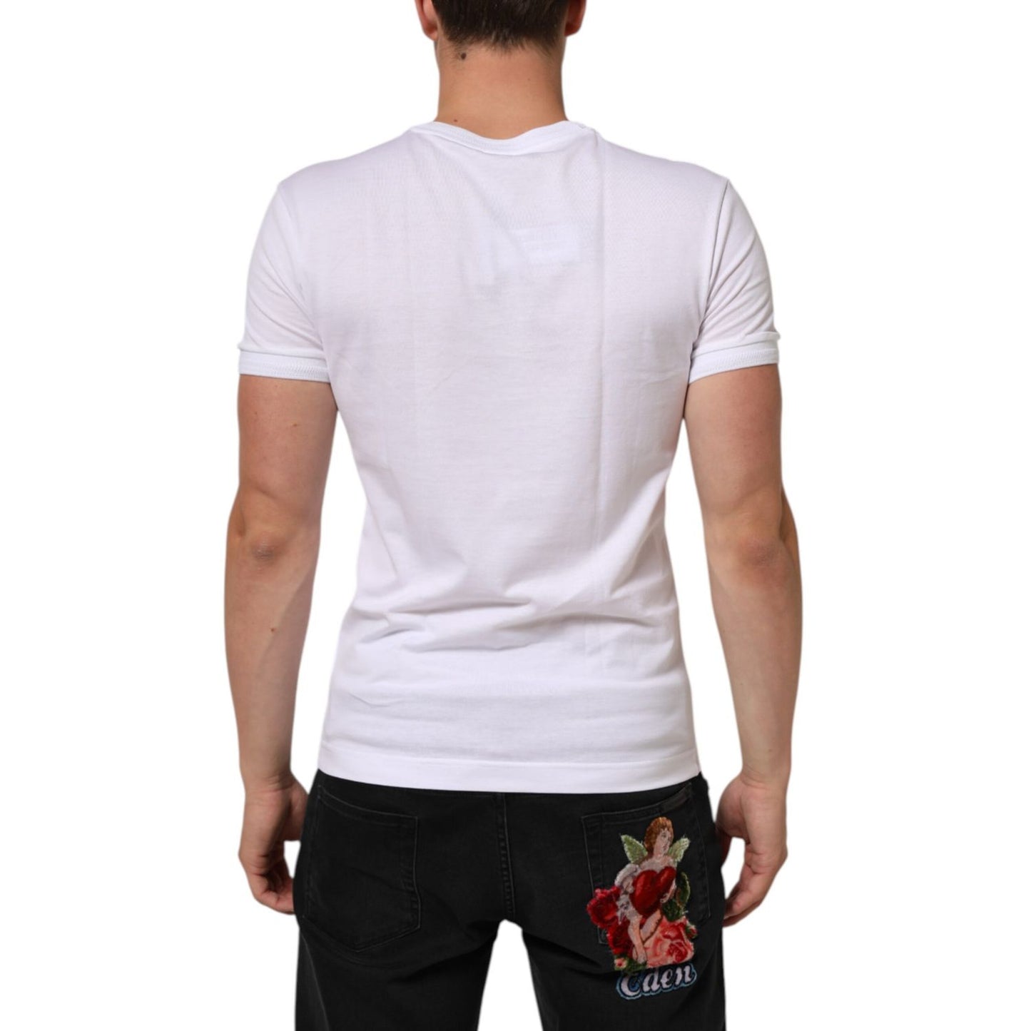 Back view of Dolce & Gabbana White Cotton Logo Patch V-neck Tee T-shirt with minor stain on the back, worn by male model.