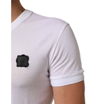 Close-up of Dolce & Gabbana White Cotton Logo Patch V-neck Tee T-shirt showcasing logo patch and short sleeve design.