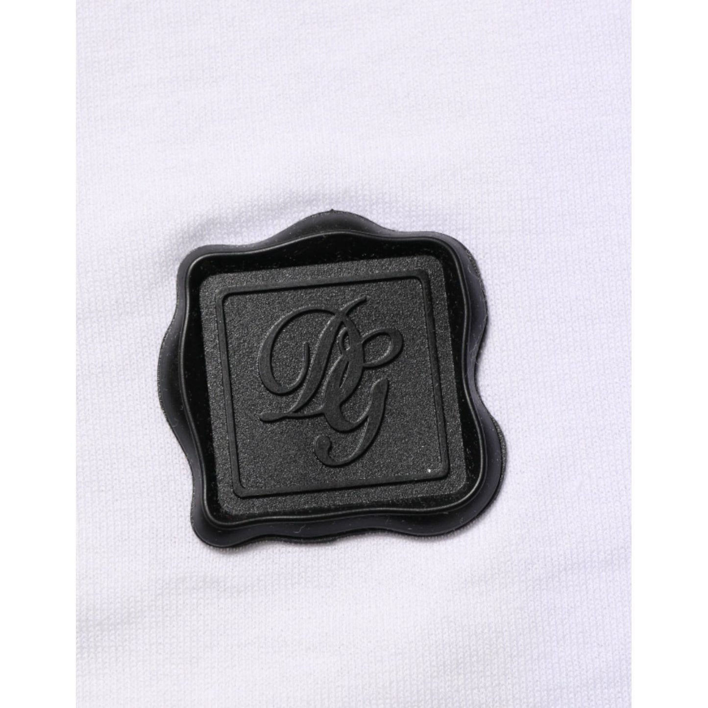 Dolce & Gabbana White Cotton Logo Patch V-neck Tee T-shirt featuring black logo emblem on soft cotton fabric.