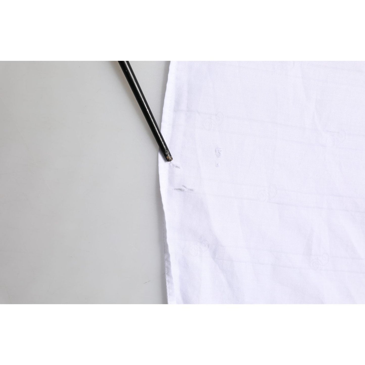 Close-up of Dolce & Gabbana White Cotton MARTINI Men Formal Dress Shirt showing fabric texture and detailing.