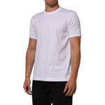 Model wearing Dolce & Gabbana White Goodluck 2021 Cotton Crew Neck T-shirt with graphic print, short sleeves, and crew neck.