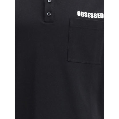 Close-up of Dsquared² Black Cotton Polo Shirt showing patch pocket and three-button closure with white lettering accent.