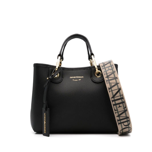 Emporio Armani MyEA small shopping bag in black faux leather with grained texture, debossed logo, adjustable strap, and gold-tone hardware.